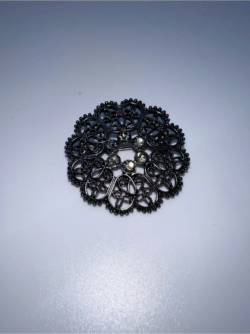 Black Filigree Round Brooch with Crystal Accents